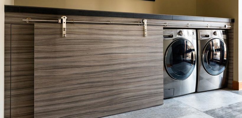 beautiful laundry room with custom woodworking